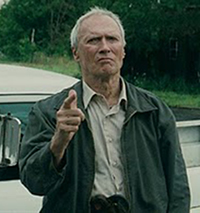 Gran Torino Walt (Clint Eastwood) points his finger gun at local hoods harassing his Korean neighbours